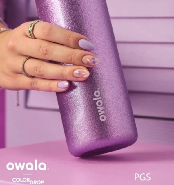 Owala So Eggstra glitter purple bottle held in hand - PGS Color Drop
