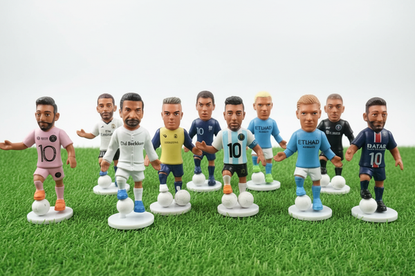 Close-up of football player mini figures in colourful jerseys