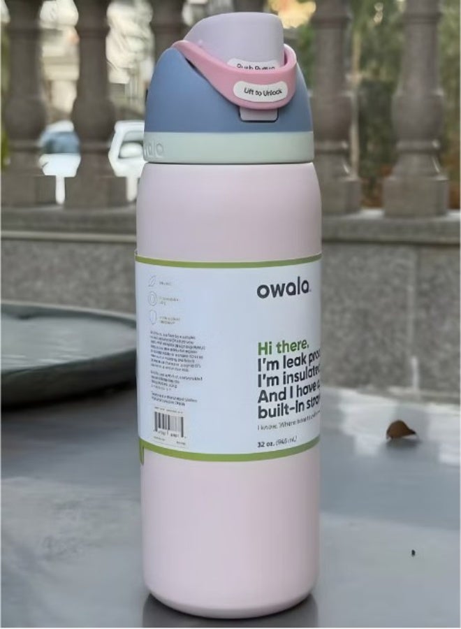 Owala FreeSip 32oz pink - outdoor lifestyle on stone surface