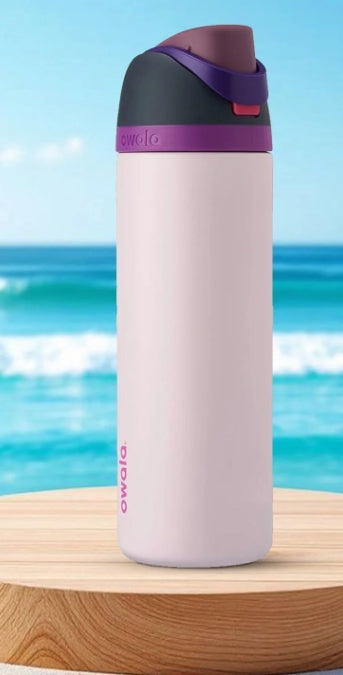 Owala FreeSip lavender purple water bottle at beach lifestyle