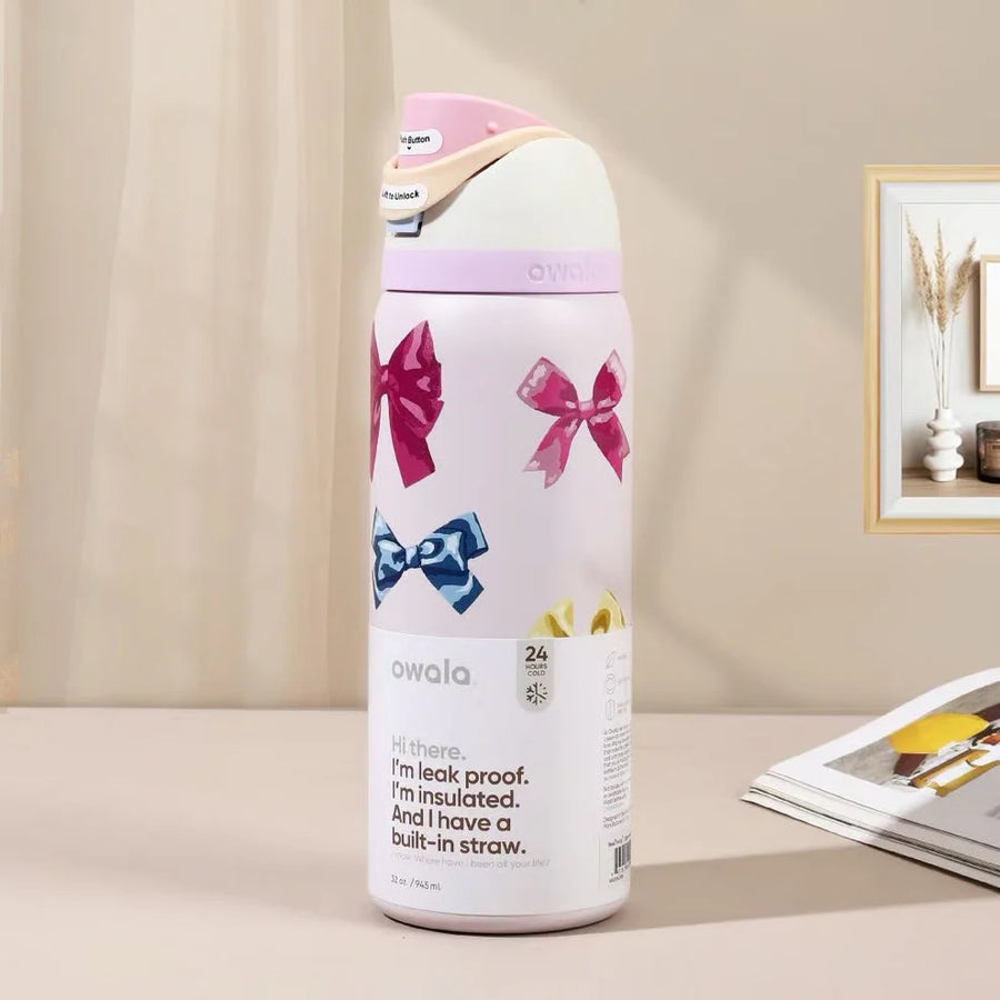 Owala FreeSip 32oz Bows Edition - lifestyle shot with magazine