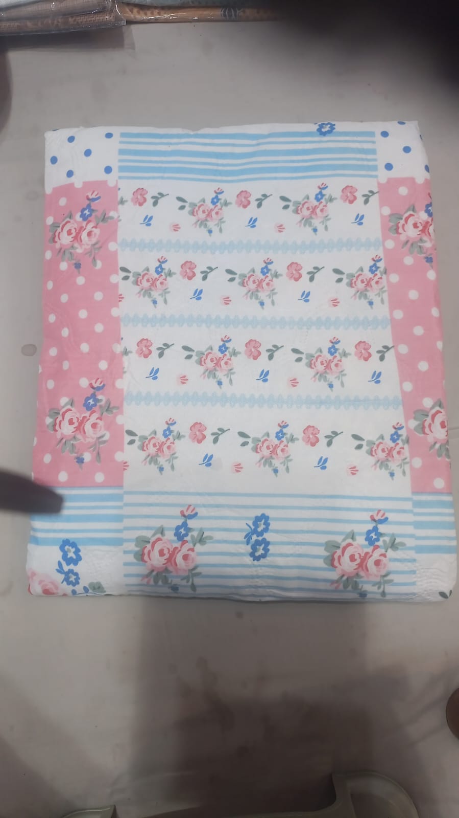 Floral striped bedsheet with pink polka dot border