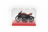 Orange black cruiser motorcycle in display box white background