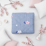 Blue floral comforter flat lay
