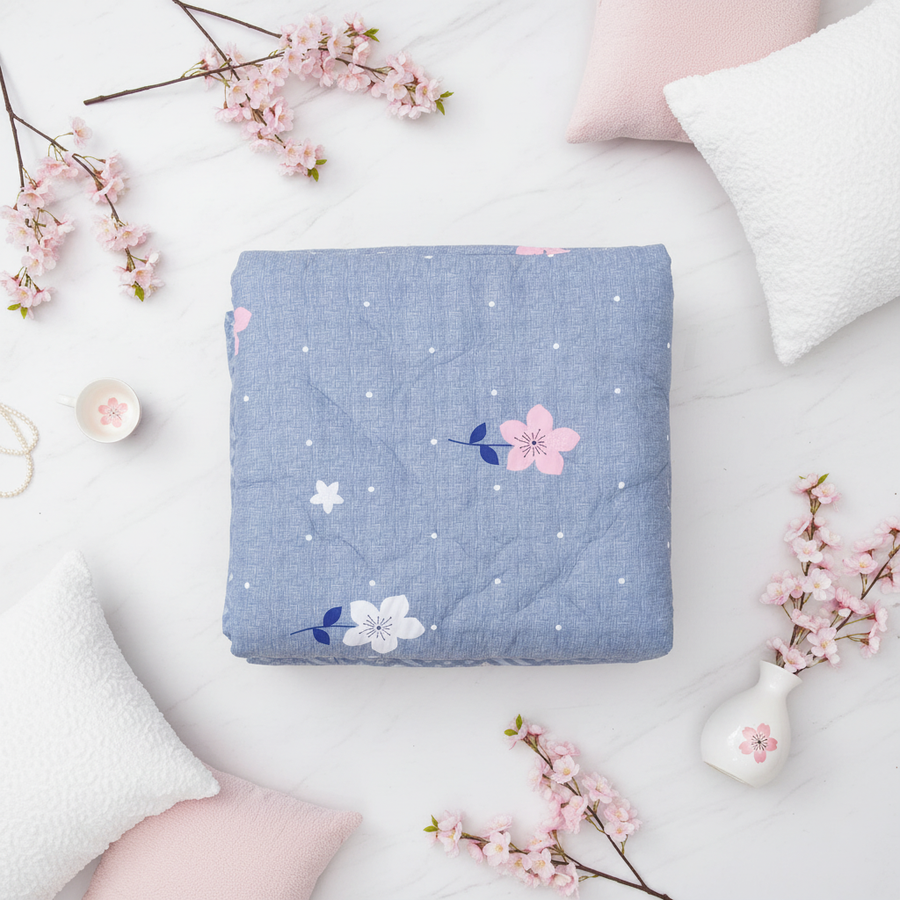 Blue floral comforter flat lay