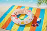 Inflatable swim ring flat lay with summer accessories