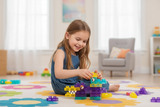 Girl playing with Magic Gummy Bloc