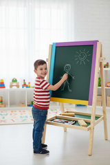 Child drawing on My First Easel