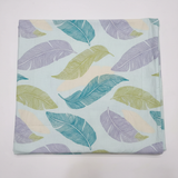 Colourful feather bedsheet flat lay